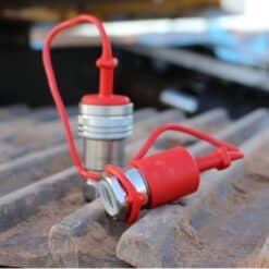 AG12-08N-SET Agricultural Quick Coupler Set sitting on construction equipment