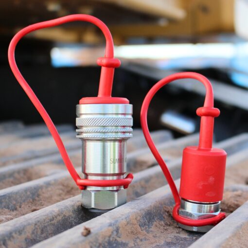 AG12-08N-SET Agricultural Quick Coupler Set sitting on construction equipment