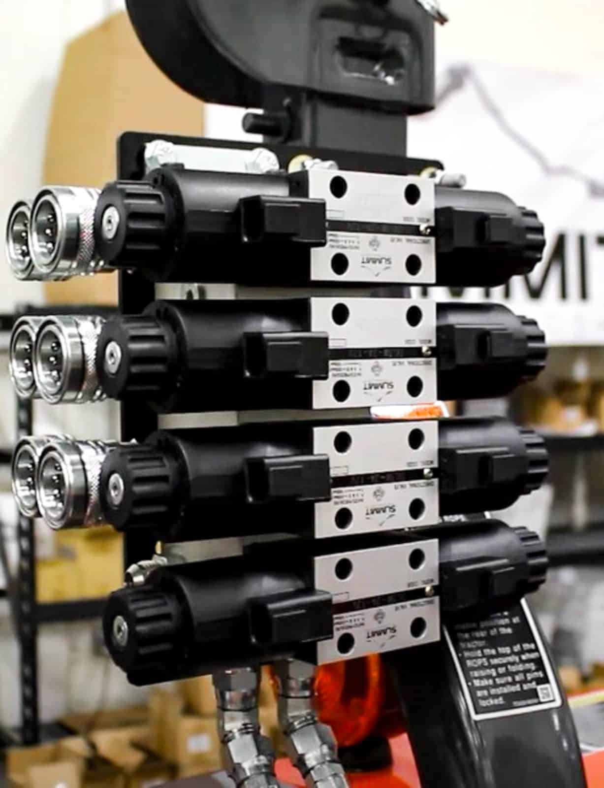 Summit Hydraulics Rear Remote and Front Third Function Kit mounted on a Kioti tractor.